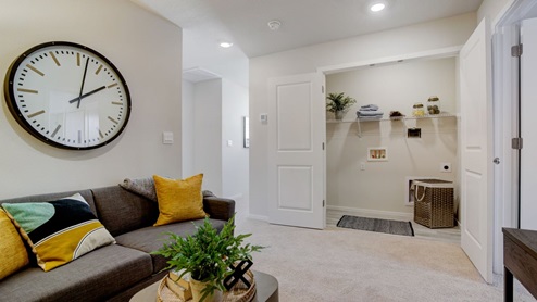 Loft area with wall-to-wall carpet