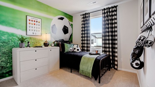 Child’s bedroom with wall-to-wall carpet and a closet