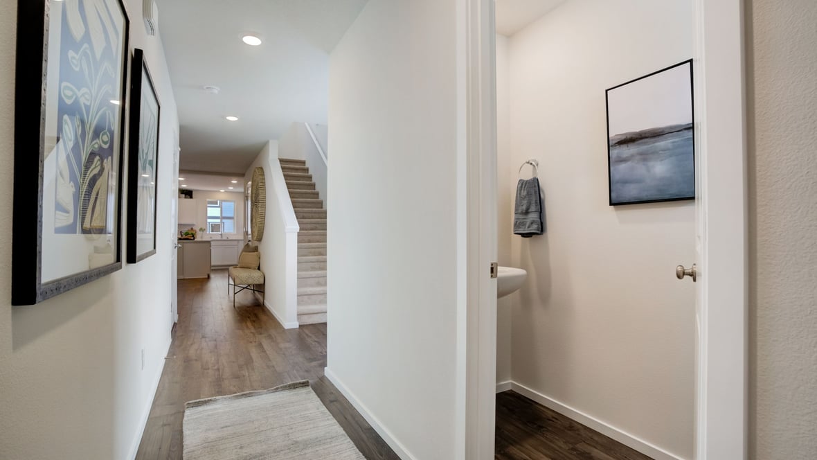 Entryway with a coat closet and laminate flooring