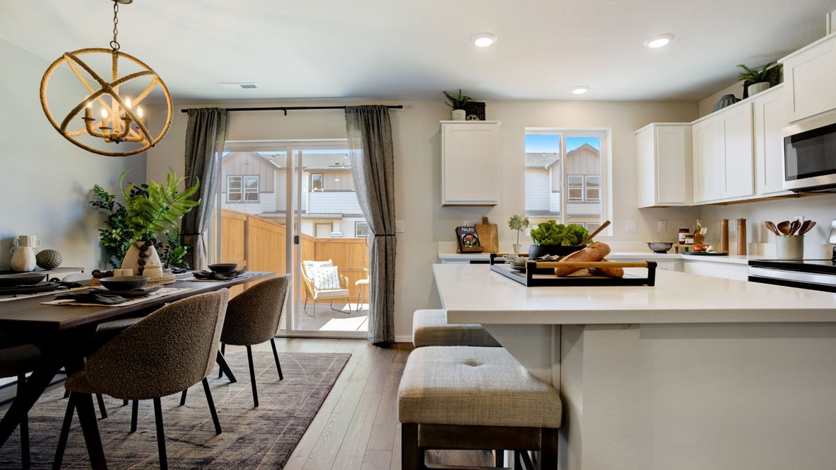 Dining area with a sliding glass door to a fenced backyard