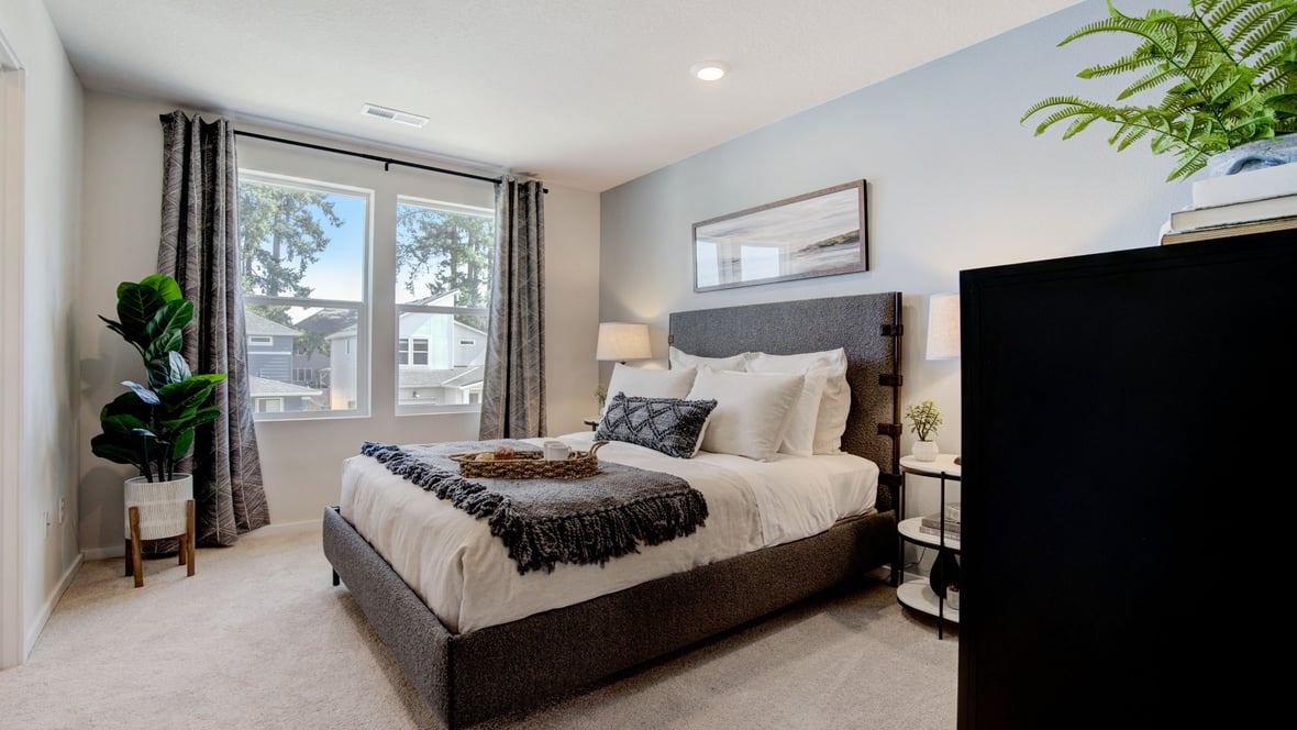 Primary bedroom with wall-to-wall carpet, a walk-in closet and an attached bathroom
