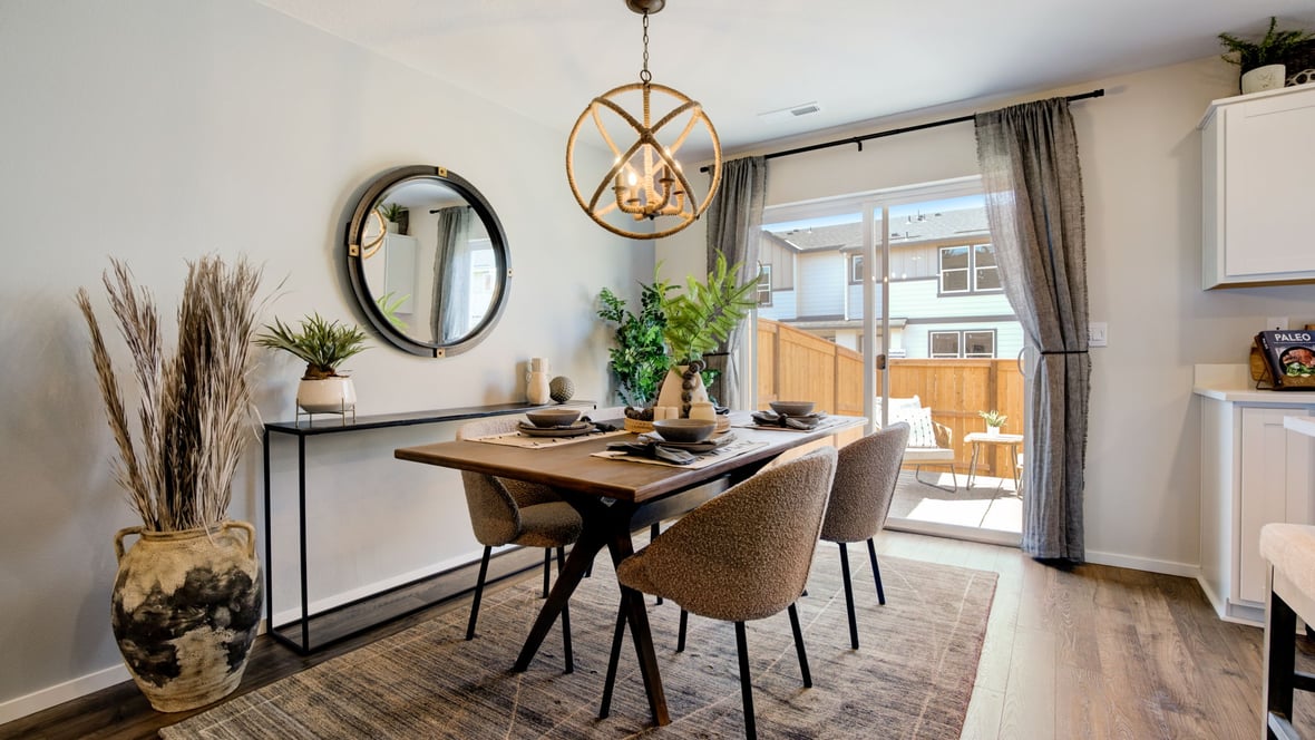 Dining area with a sliding glass door to a fenced backyard