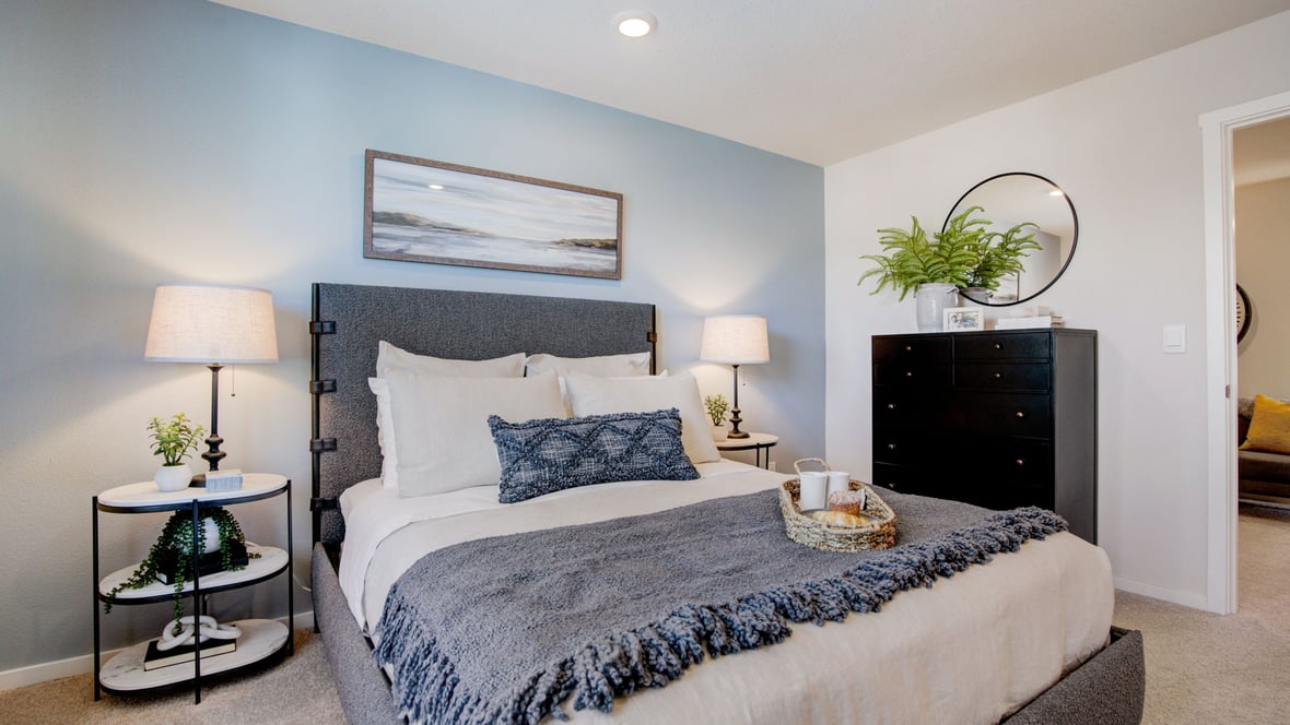 Primary bedroom with wall-to-wall carpet, a walk-in closet and an attached bathroom