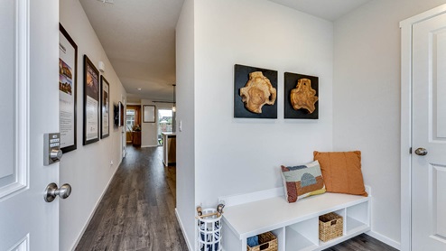 foyer with built in bench and closet
