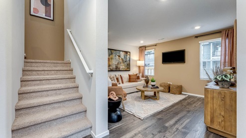 living room with premium laminate vinyl flooring next to staircase