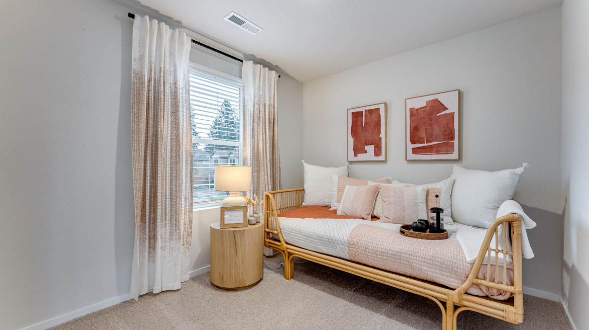 Bedroom with wall-to-wall carpet and a closet