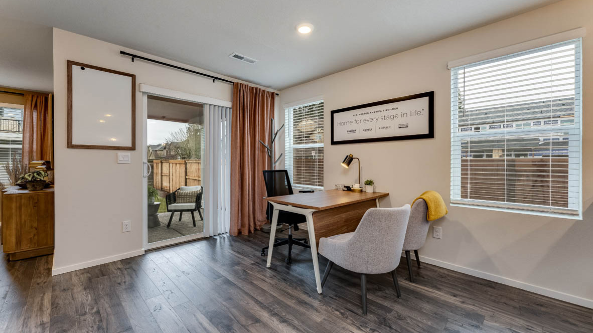 Dining area with a sliding glass door to a fenced backyard