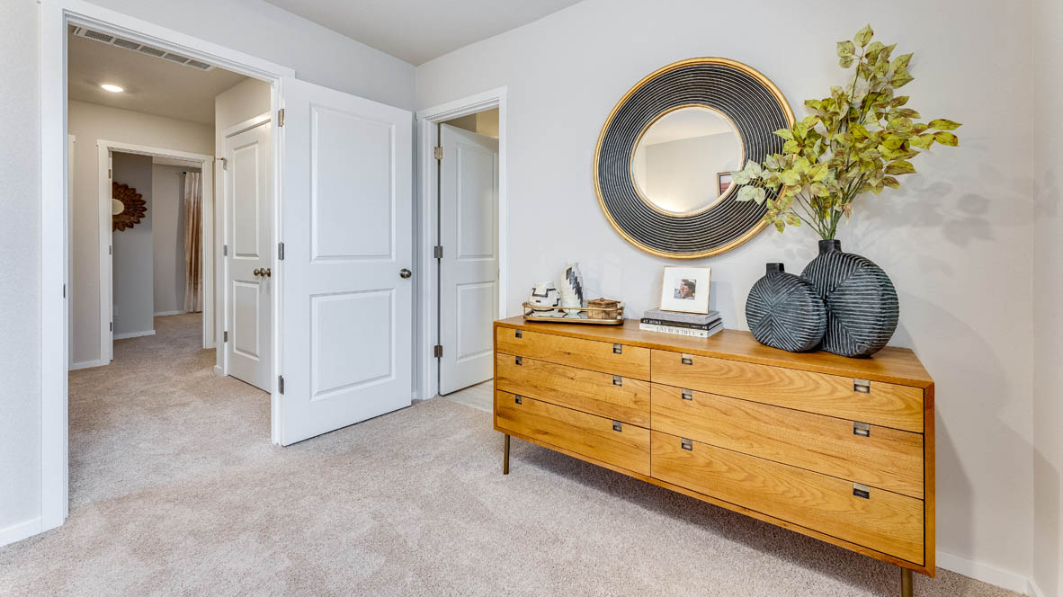 Primary bedroom with wall-to-wall carpet, a walk-in closet and an attached bathroom