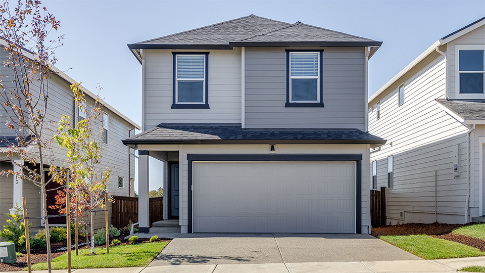 gray 2-story home with a 2-car garage