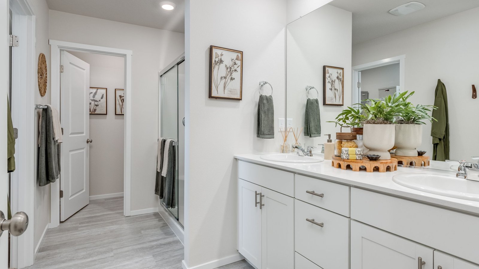 Primary bathroom with quartz counters and a walk-in shower