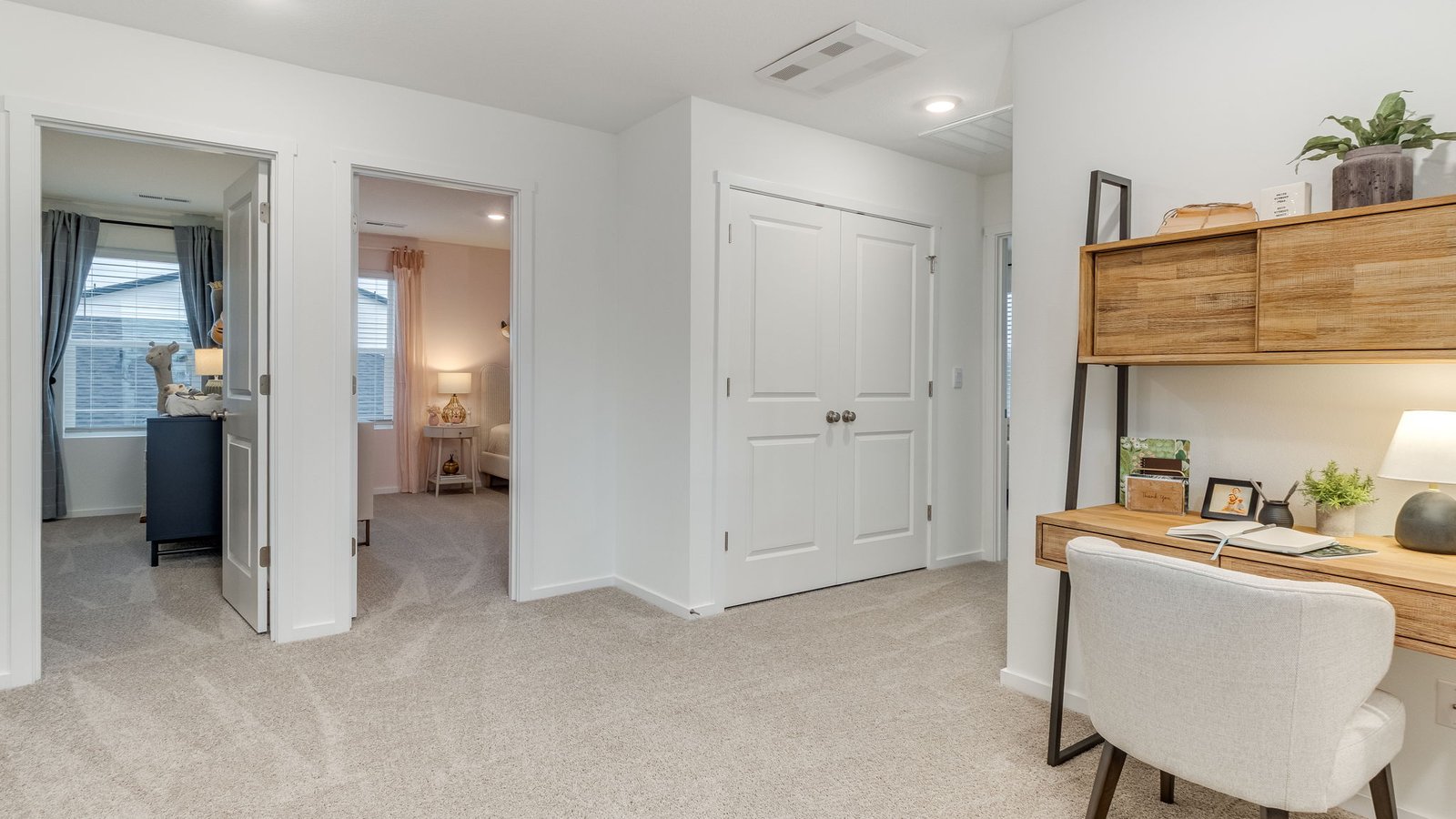 Hallway with wall-to-wall carpet