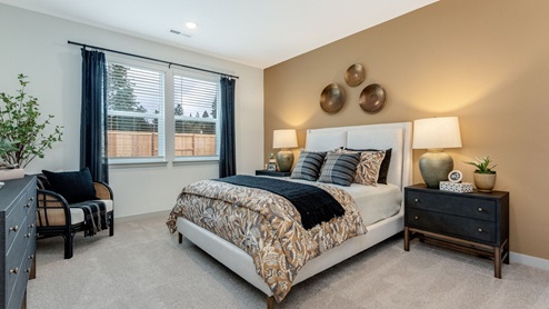Primary bedroom with wall-to-wall carpet, a walk-in closet and an attached bathroom