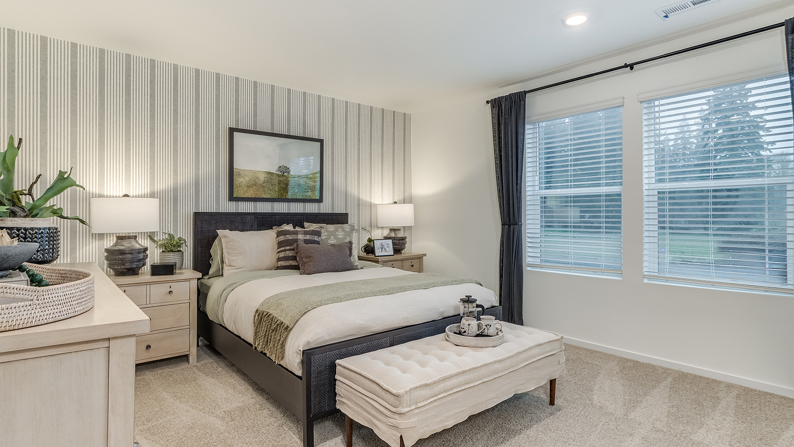 Primary bedroom with wall-to-wall carpet, a walk-in closet and an attached bathroom
