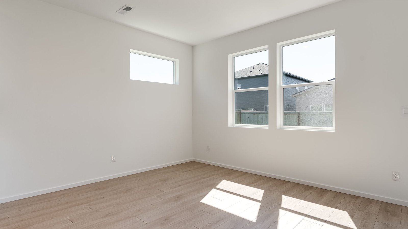 Dining area with a sliding glass door to a fenced backyard