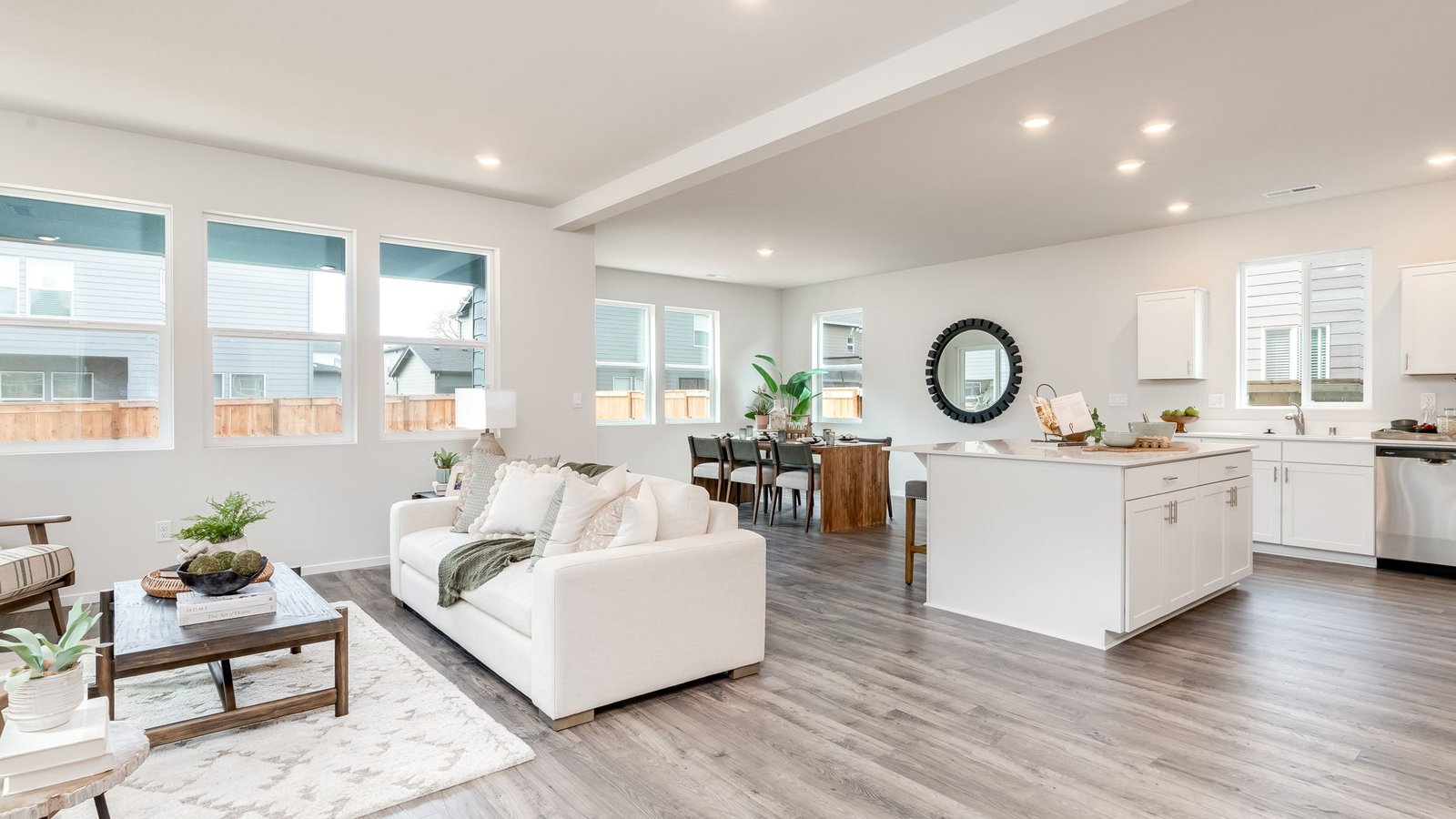 Great room with laminate flooring and an electric fireplace