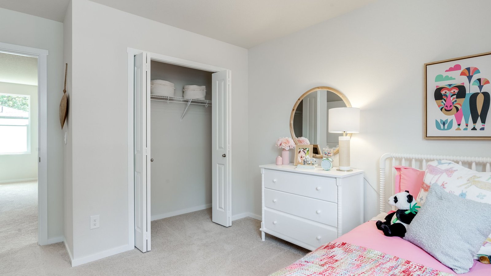 Bedroom with wall-to-wall carpet and a closet