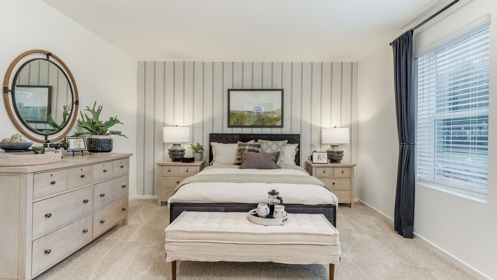Primary bedroom with wall-to-wall carpet, a walk-in closet and an attached bathroom