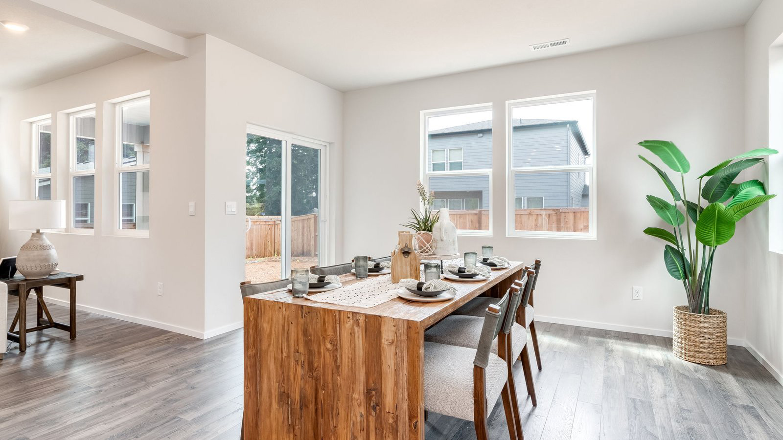 Dining area with a sliding glass door to a fenced backyard