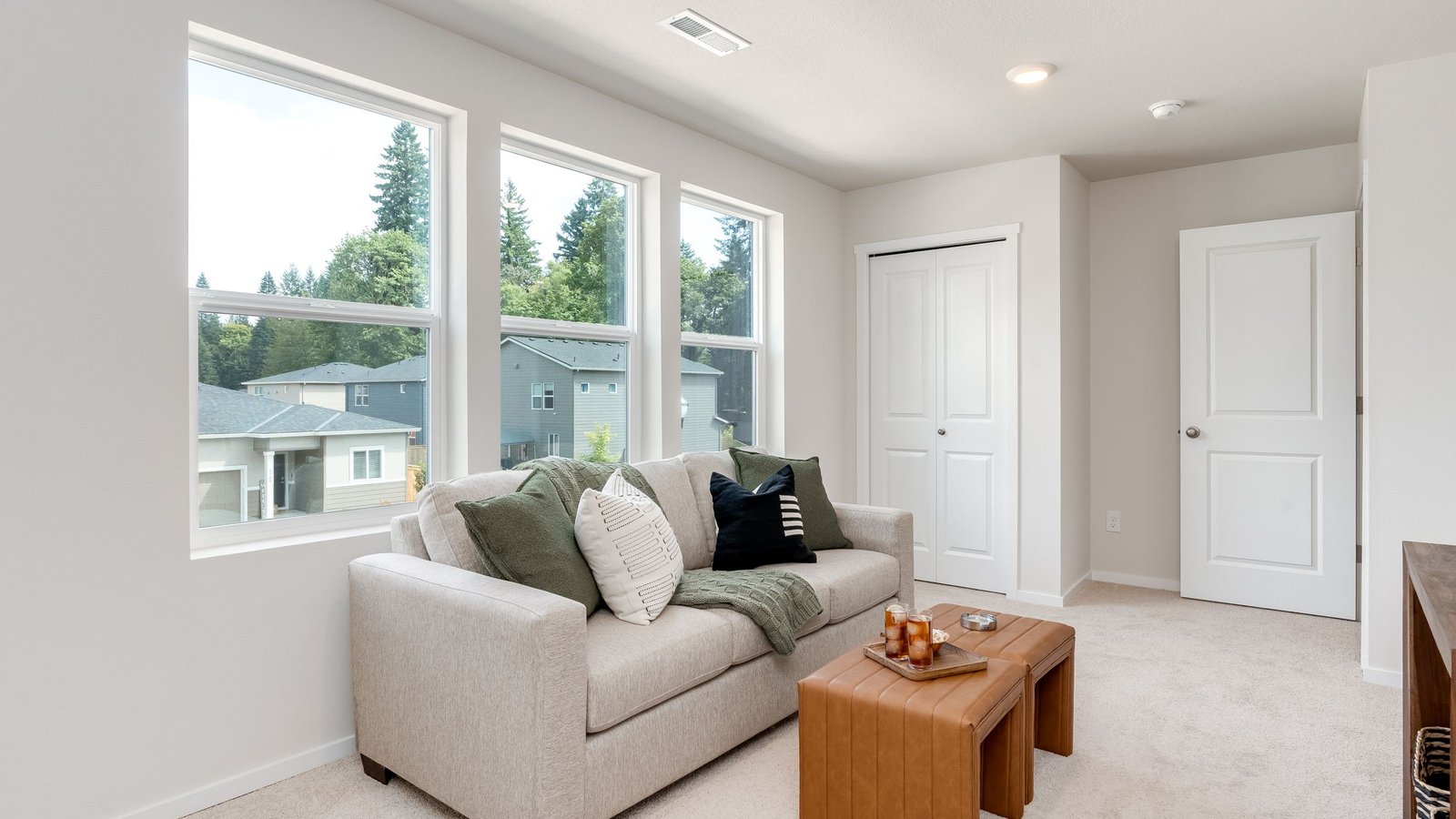 Bedroom with wall-to-wall carpet and a closet