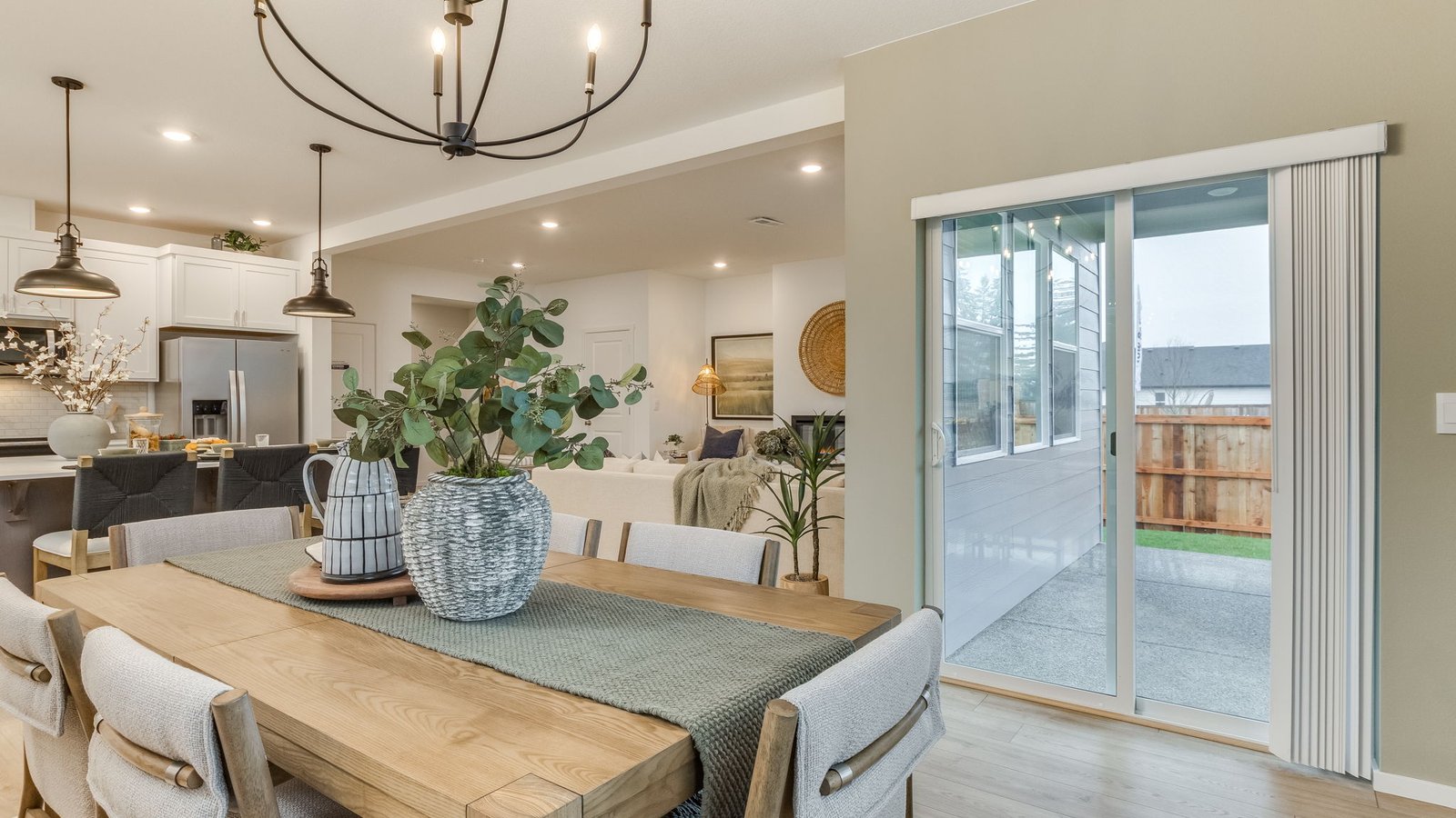 Dining area with a sliding glass door to a fenced backyard