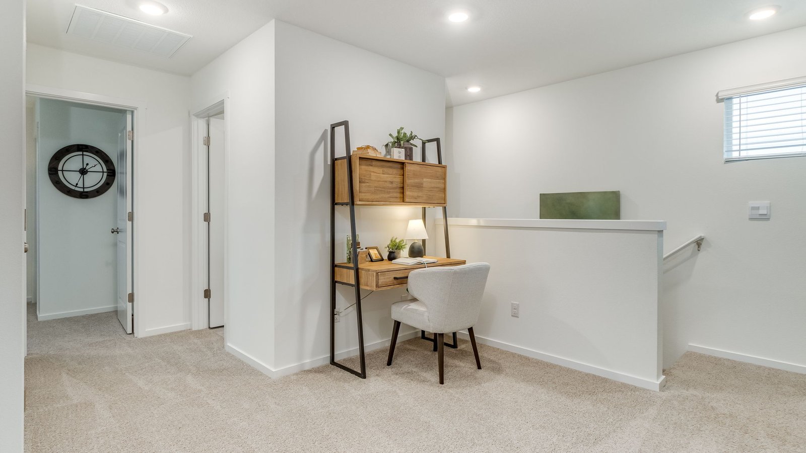 Hallway with wall-to-wall carpet