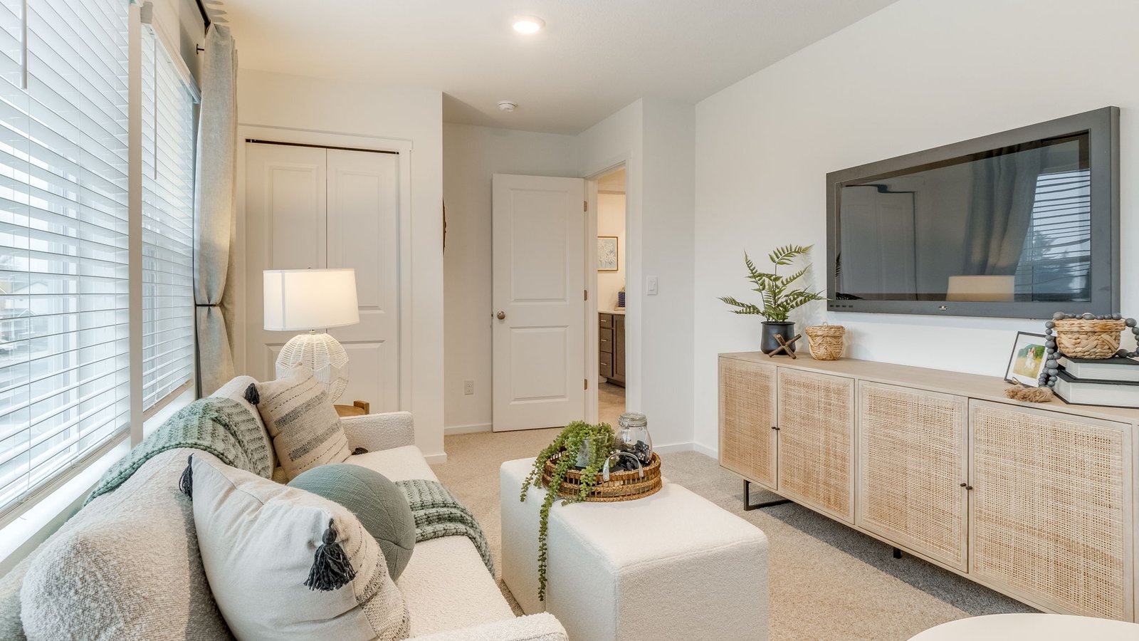 Bedroom with wall-to-wall carpet and a closet