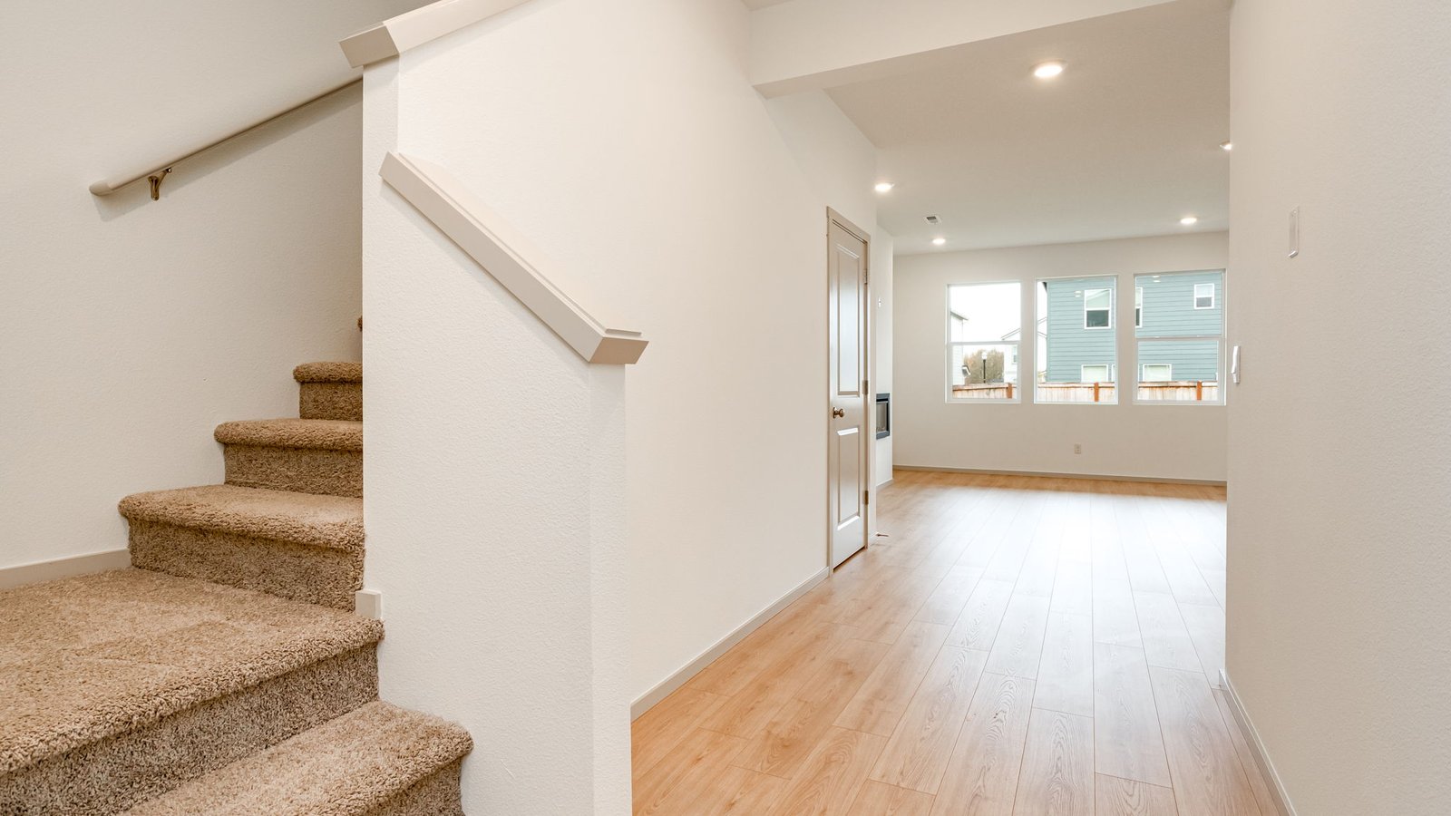 Entryway with a coat closet and laminate flooring