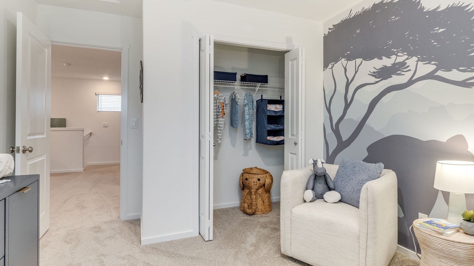 Bedroom with wall-to-wall carpet and a closet