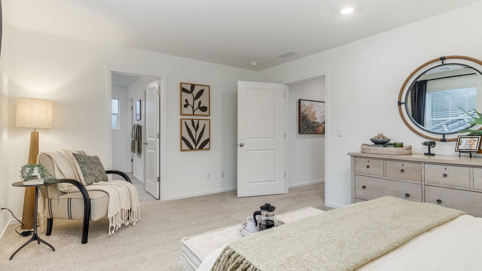 Primary bedroom with wall-to-wall carpet, a walk-in closet and an attached bathroom