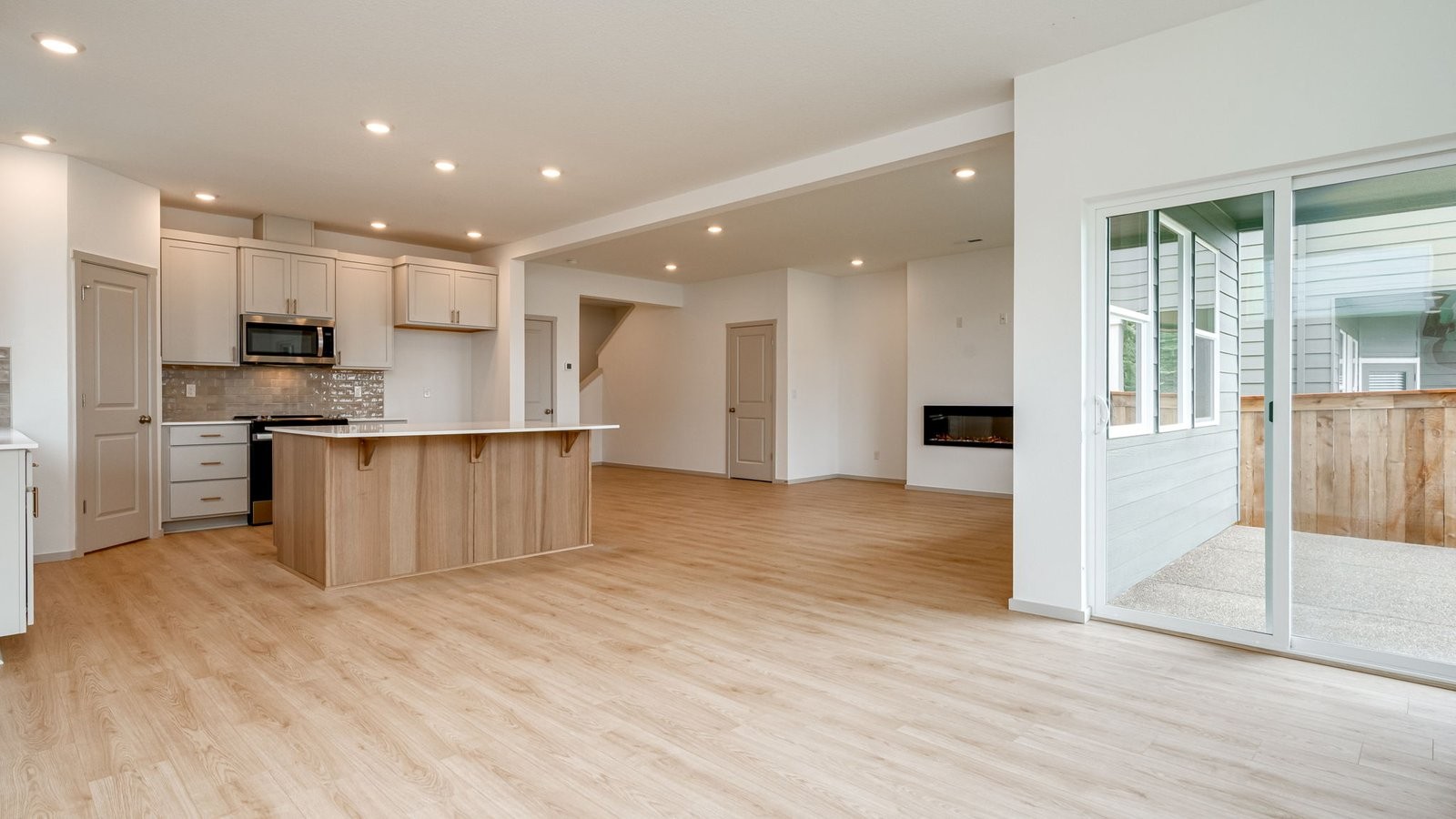 Dining area with a sliding glass door to a fenced backyard