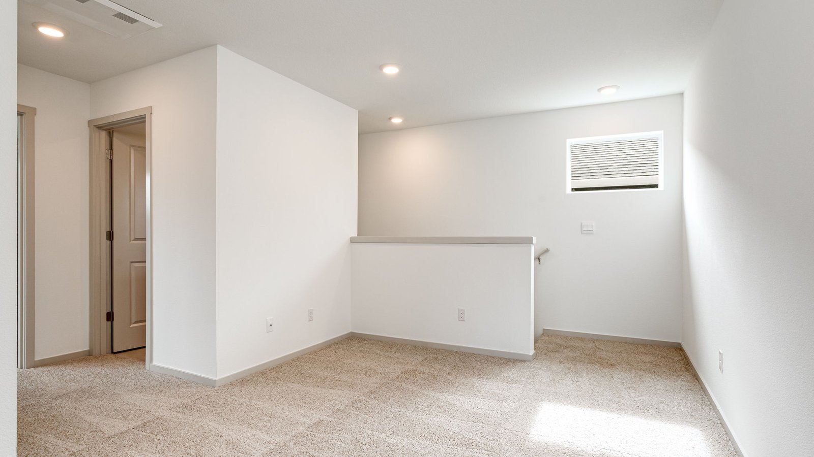 Hallway with wall-to-wall carpet