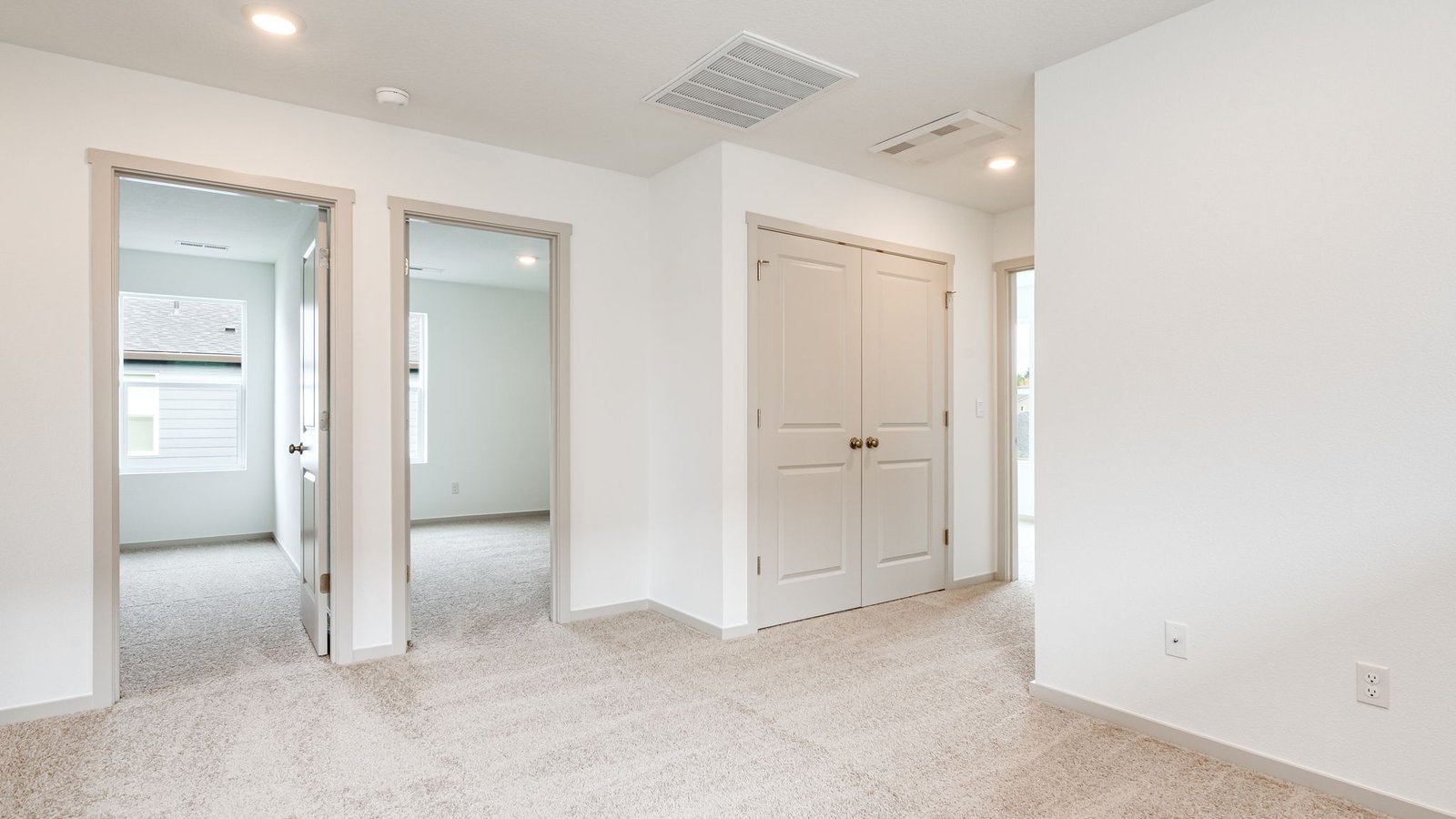 Hallway with wall-to-wall carpet