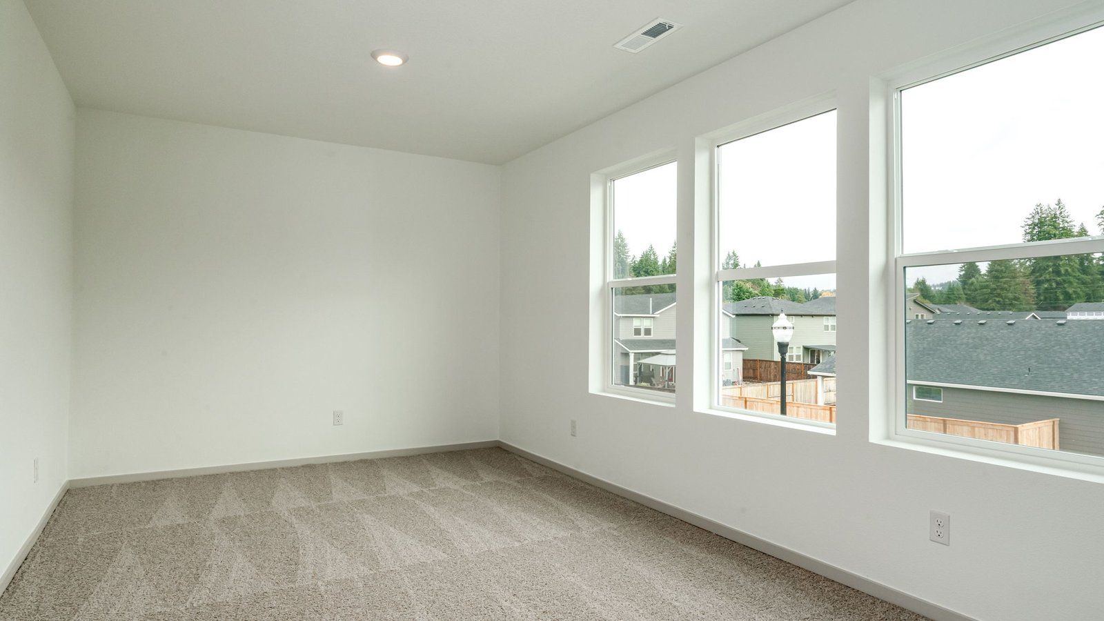 Bedroom with wall-to-wall carpet and a closet