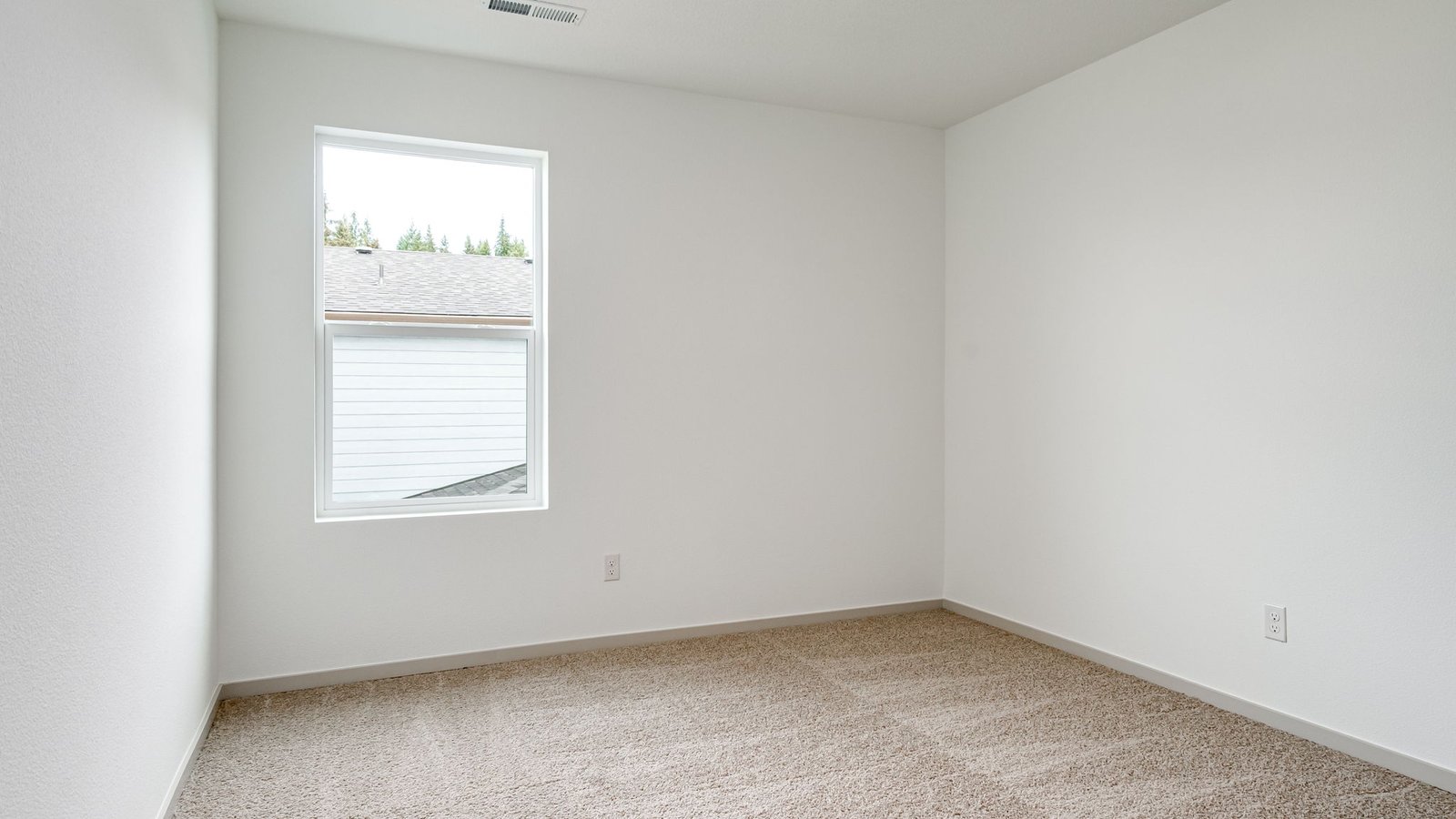 Bedroom with wall-to-wall carpet and a closet