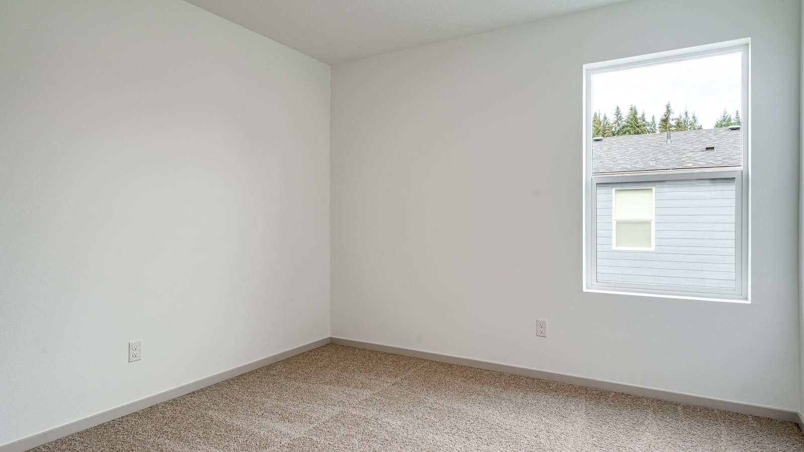 Bedroom with wall-to-wall carpet and a closet