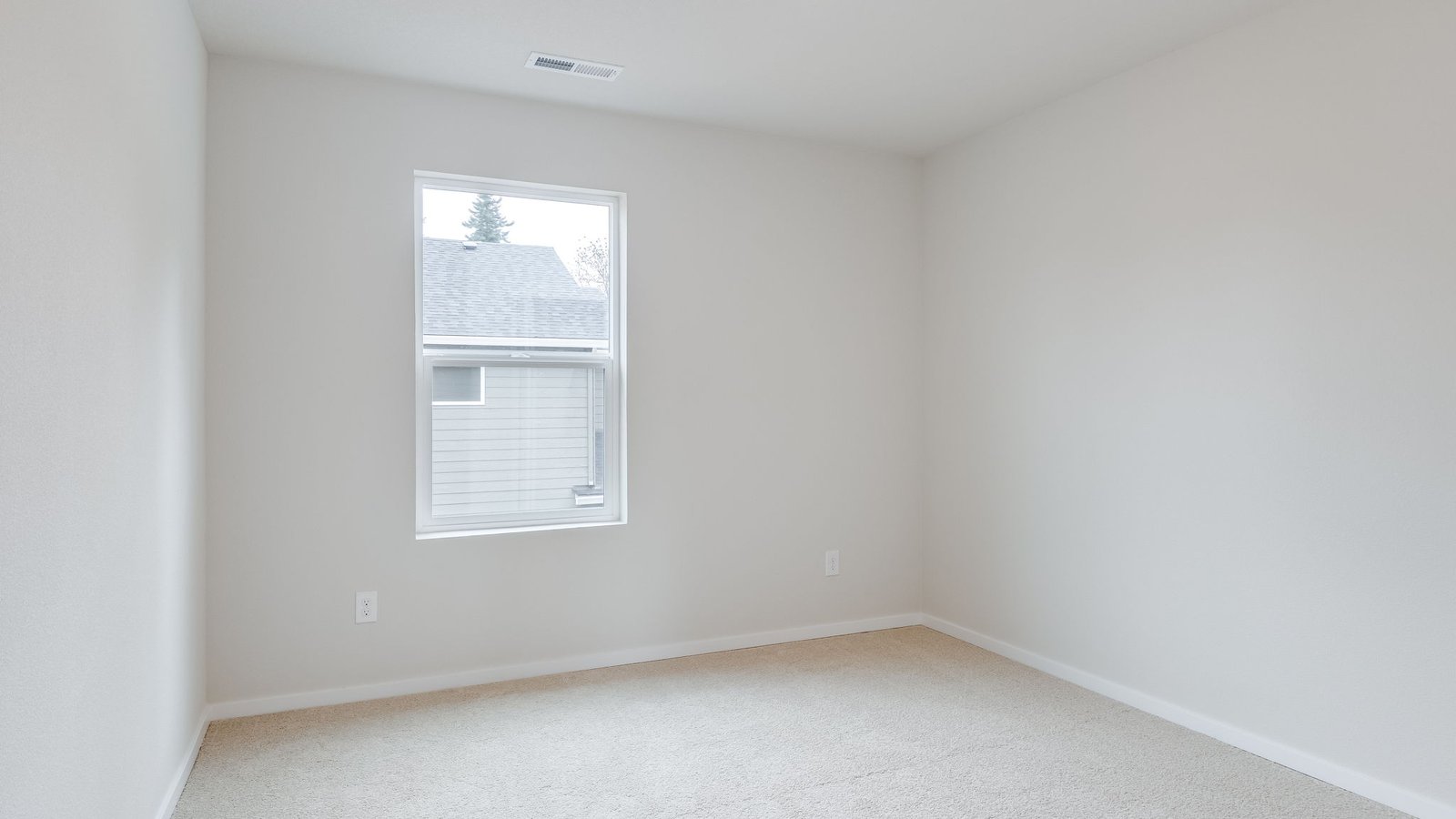 Bedroom with wall-to-wall carpet and a closet