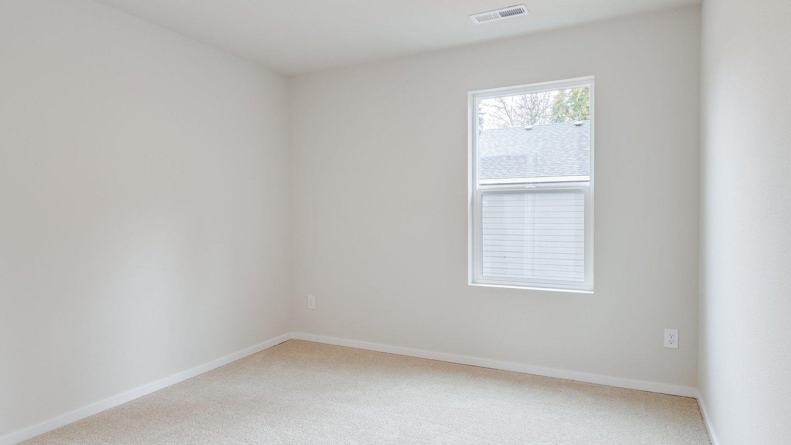 Bedroom with wall-to-wall carpet and a closet