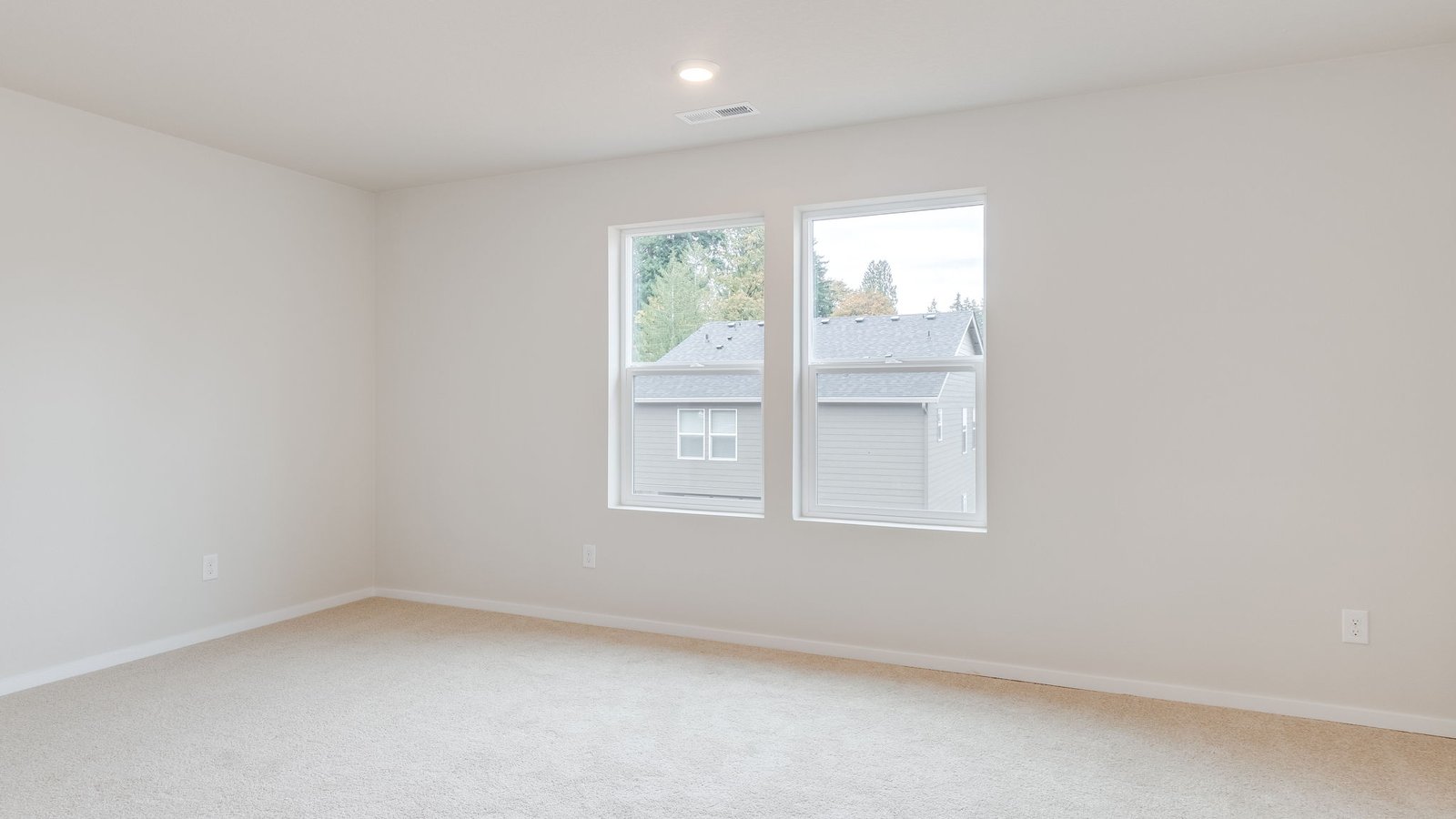Primary bedroom with wall-to-wall carpet, a walk-in closet and an attached bathroom
