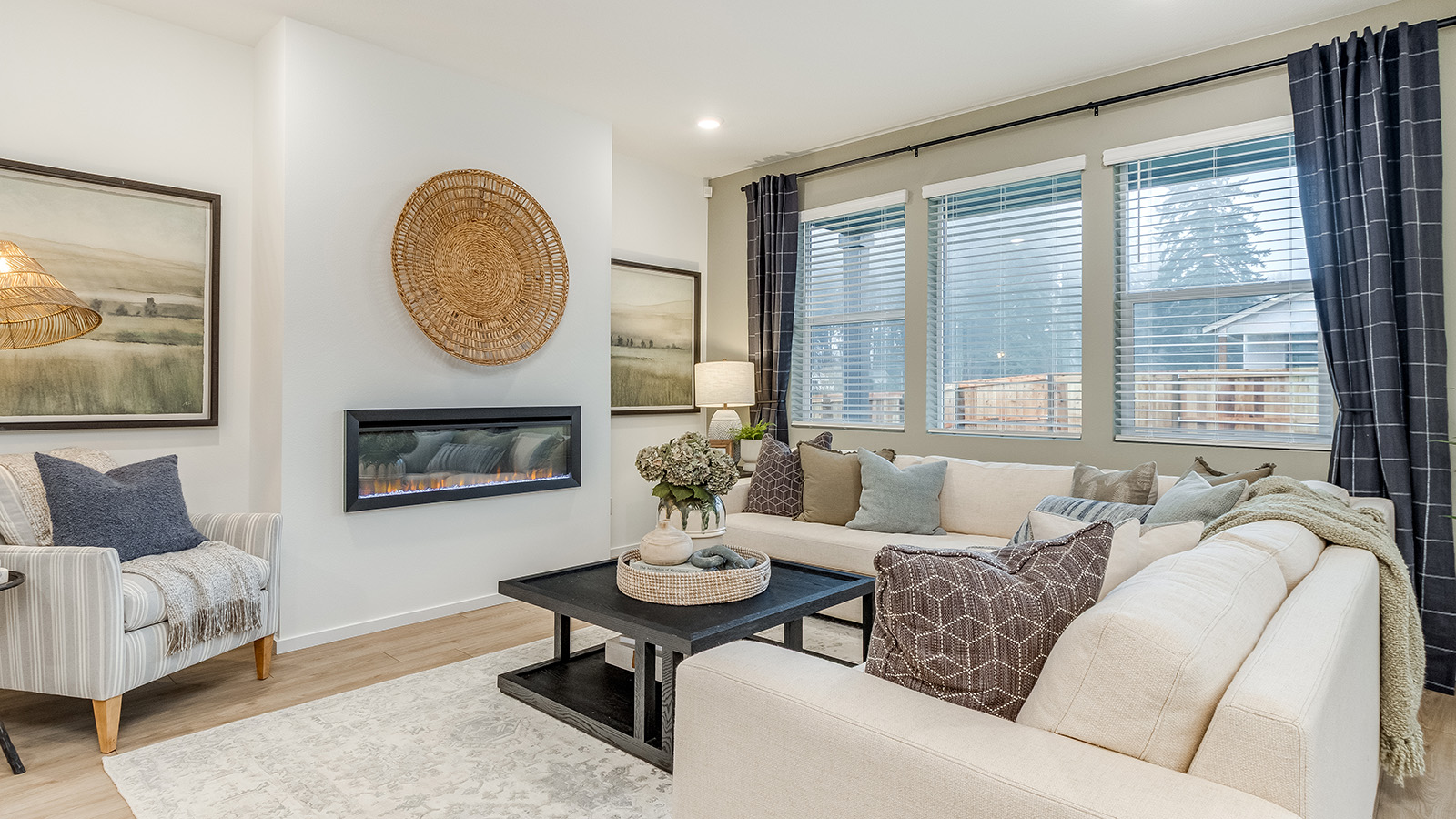 Great room with laminate flooring and an electric fireplace