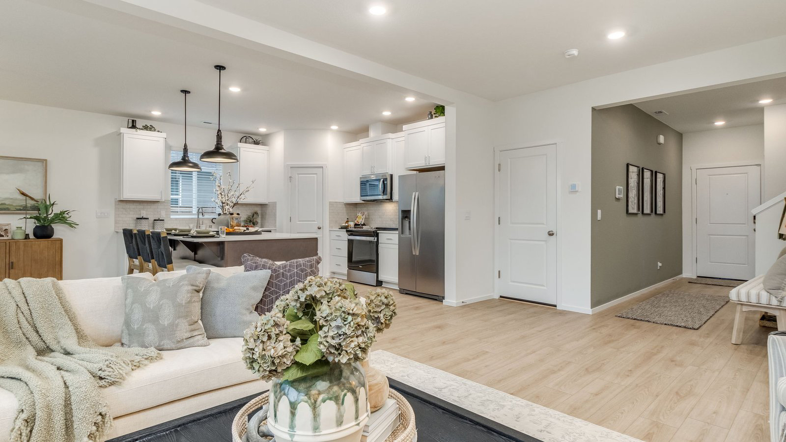Great room with laminate flooring and an electric fireplace