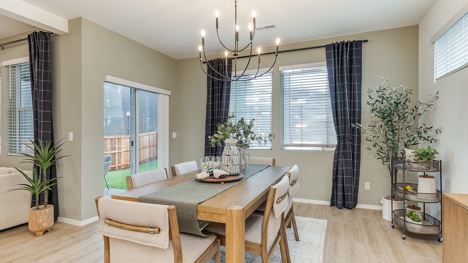 Dining area with a sliding glass door to a fenced backyard