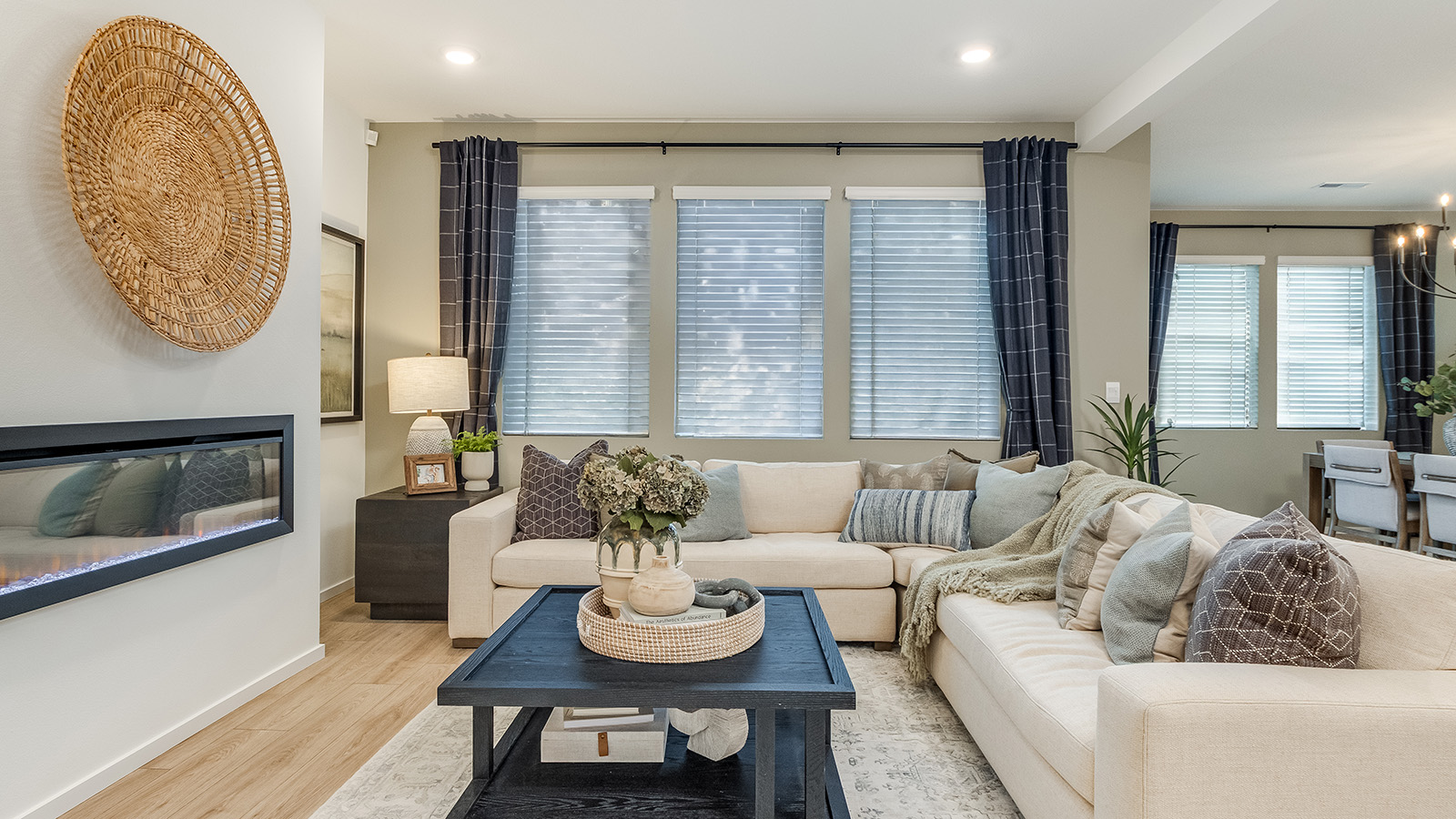 Great room with laminate flooring and an electric fireplace