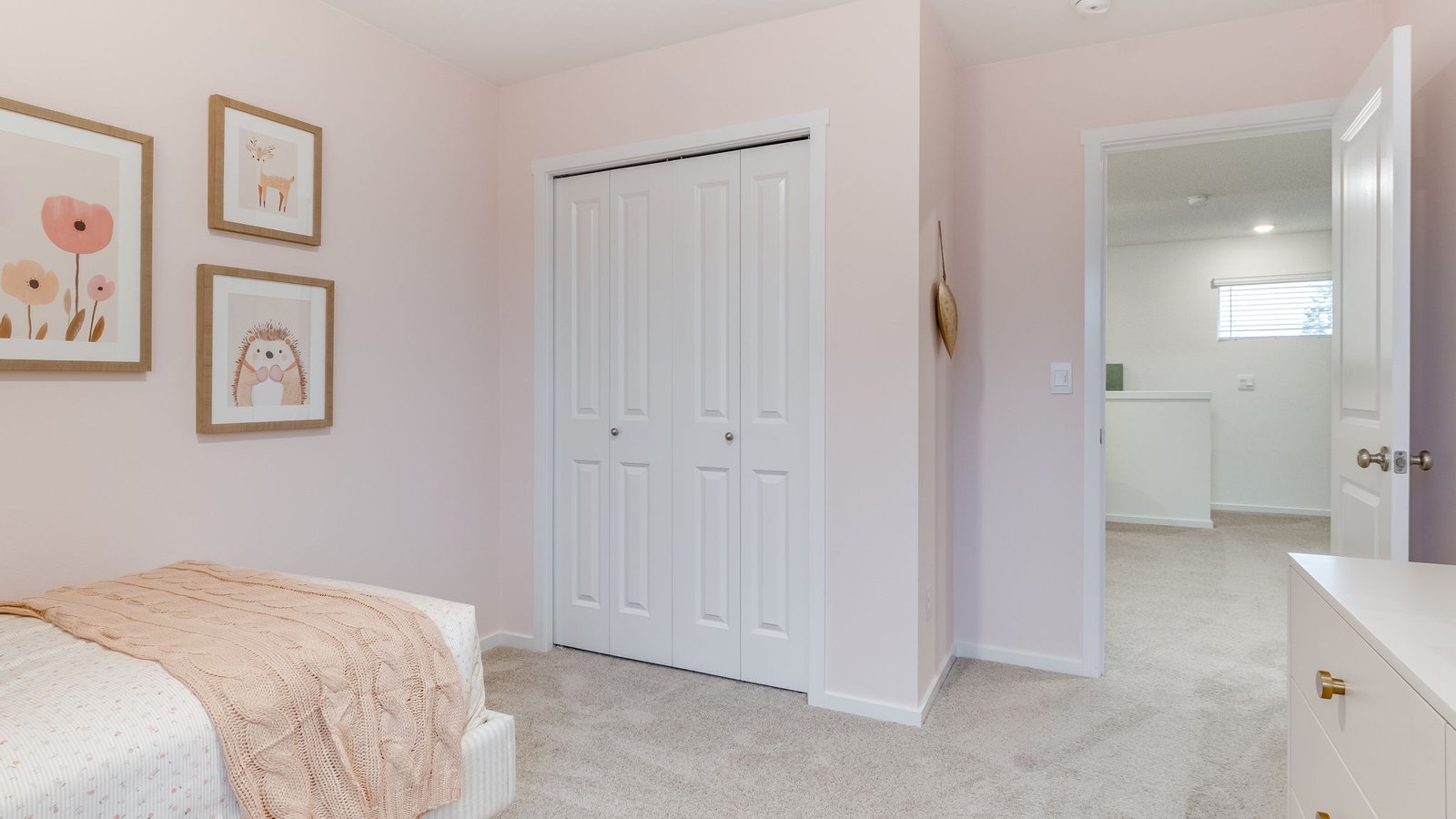 Bedroom with wall-to-wall carpet and a closet