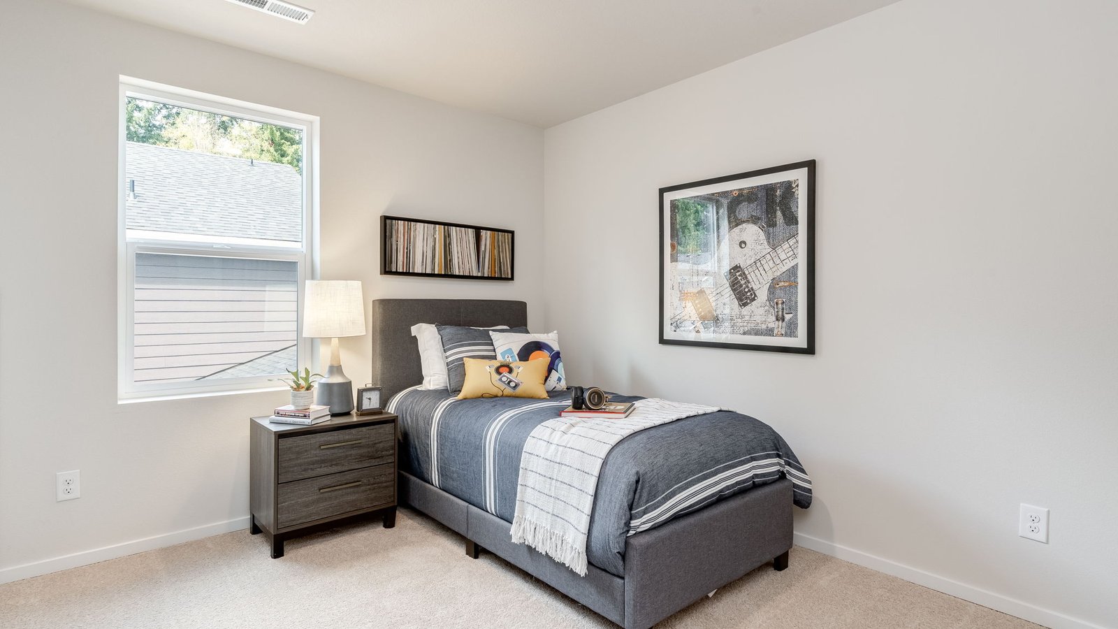 Bedroom with wall-to-wall carpet and a closet