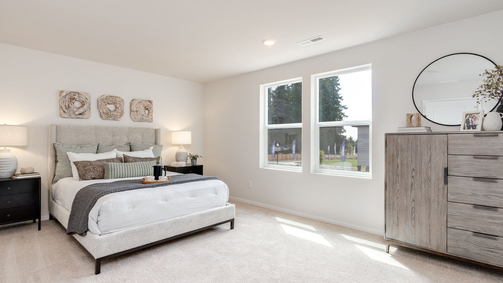 Primary bedroom with wall-to-wall carpet, a walk-in closet and an attached bathroom
