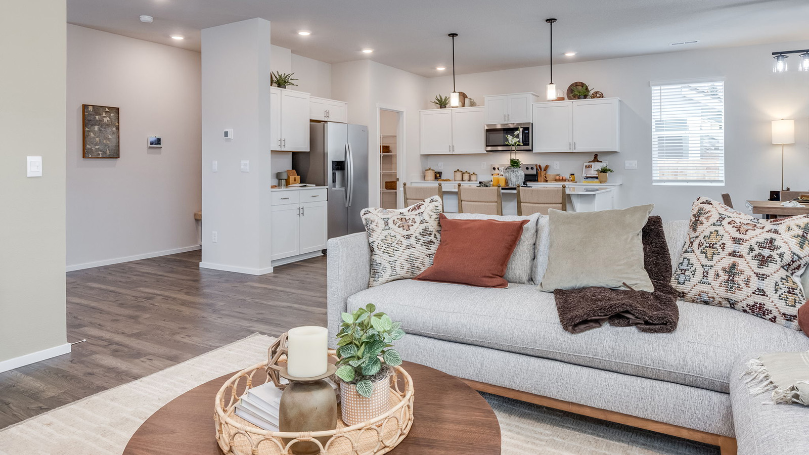 Great room with laminate flooring and an electric fireplace