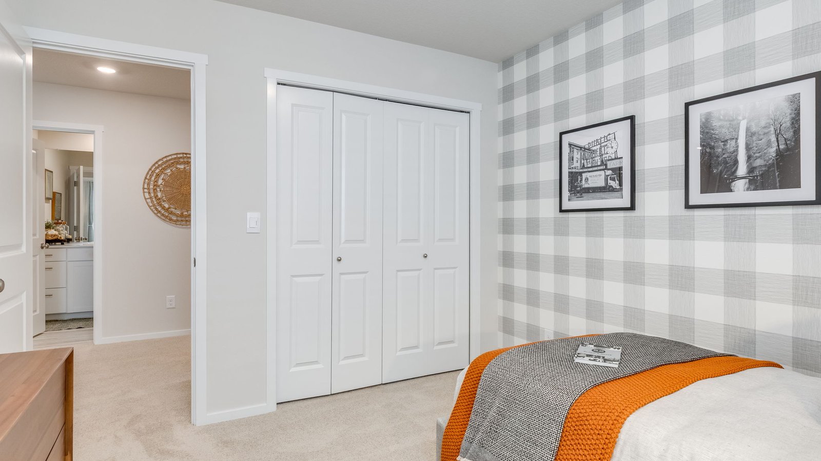 Bedroom with wall-to-wall carpet and a closet