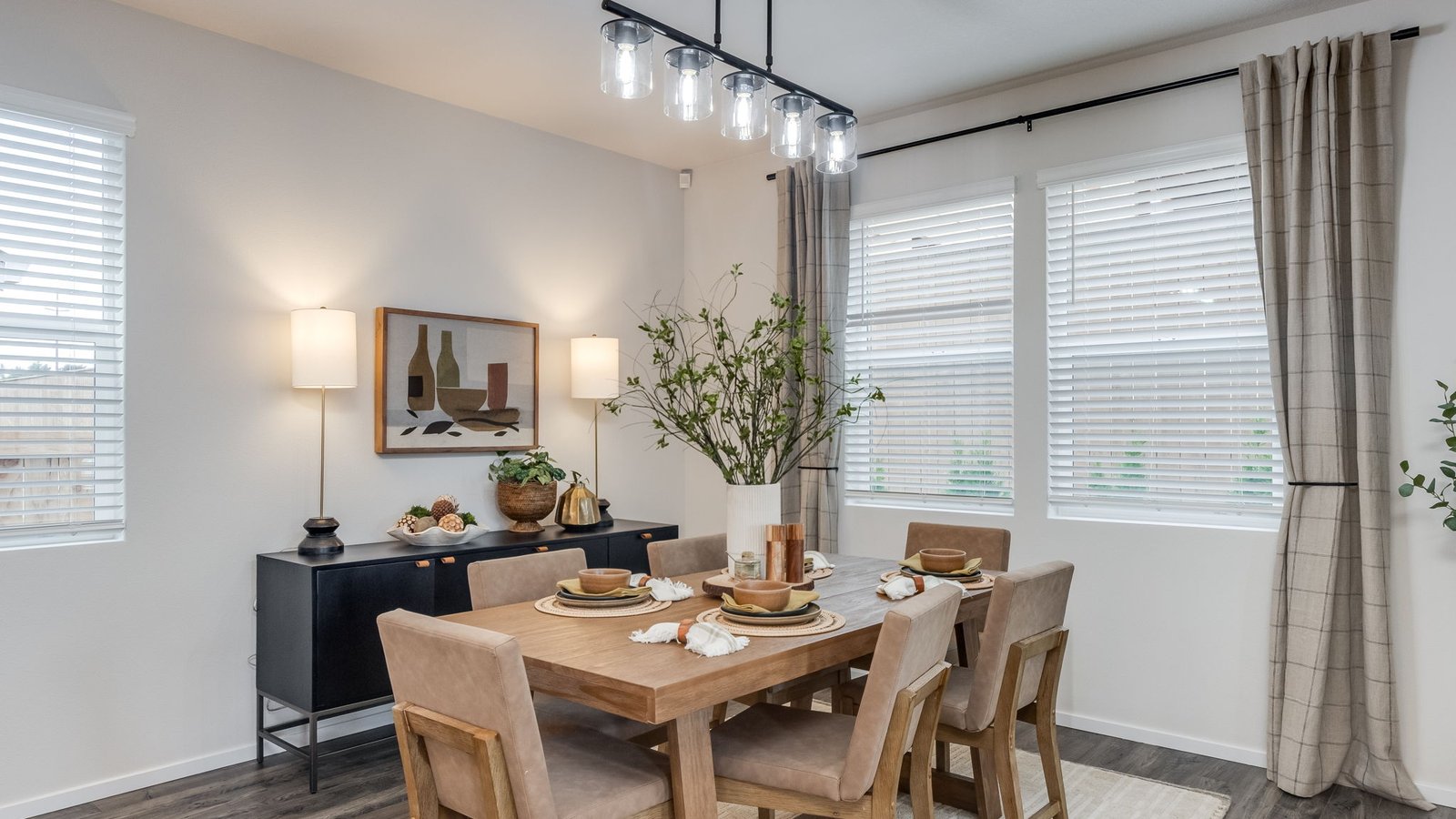 Dining area with a sliding glass door to a fenced backyard