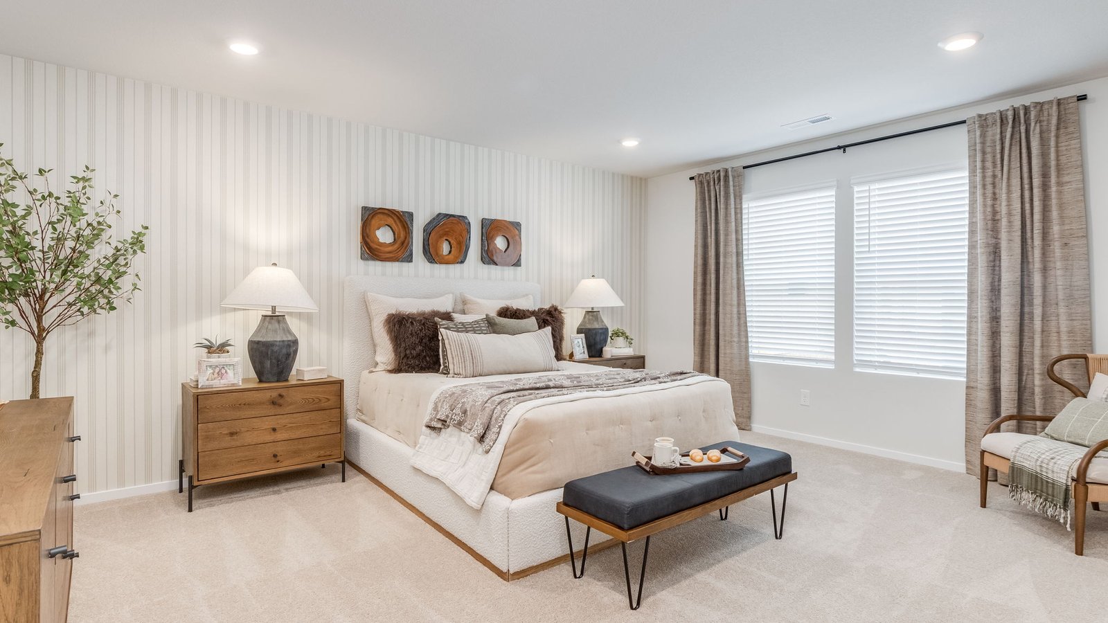 Primary bedroom with wall-to-wall carpet, a walk-in closet and an attached bathroom