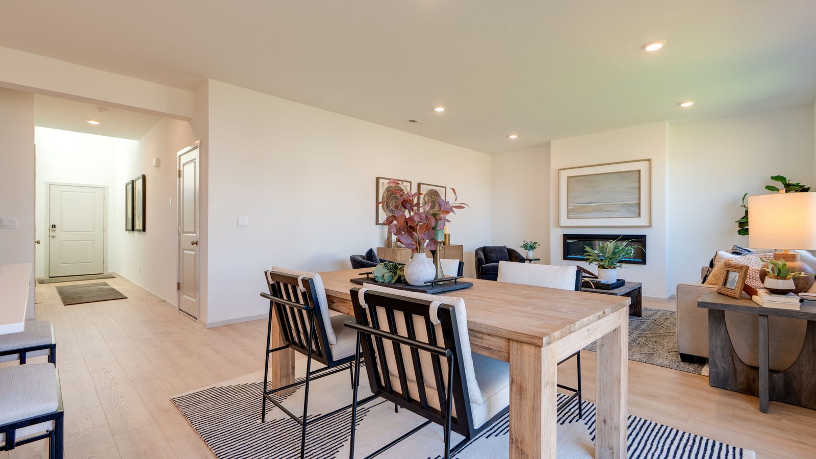 Great room with laminate flooring and an electric fireplace
